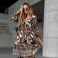 Elegante jurk met V-hals, lange mouwen en print