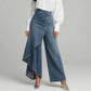 Asymmetrische wrap jeans 👖 Een combinatie van culottes en een pantalon, met een hoge taille voor een optisch langer lijkend effect, wijde pijpen en een zwierige pasvorm, en diagonaal geplaatste knopen – transformeer jezelf direct in een fashionista!