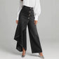 Asymmetrische wrap jeans 👖 Een combinatie van culottes en een pantalon, met een hoge taille voor een optisch langer lijkend effect, wijde pijpen en een zwierige pasvorm, en diagonaal geplaatste knopen – transformeer jezelf direct in een fashionista!