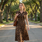 👗 Elegante damesjurk met revers en luipaardprint